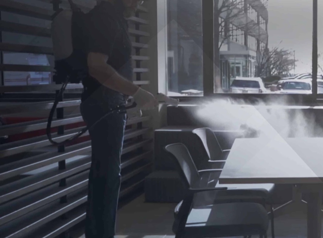 Servi-Tek specialist applying electrostatic disinfection spray